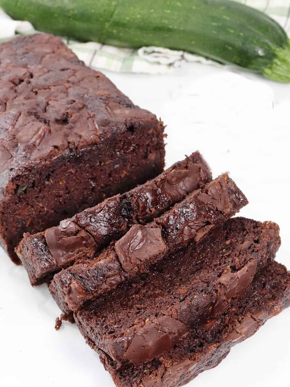 Slice Double Chocolate Zucchini Bread on table.