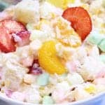 Closeup showing ingredients covered with yogurt with a garnish of sliced strawberries.