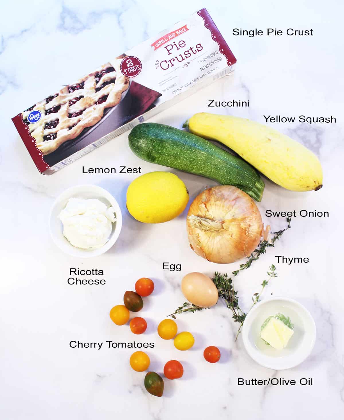 Ingredients for galette on white marble table.