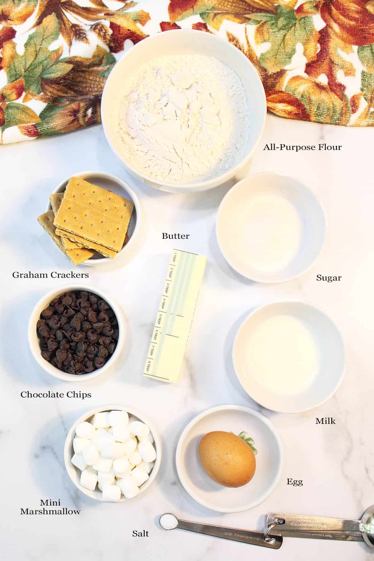 Ingredients on white table with labels.