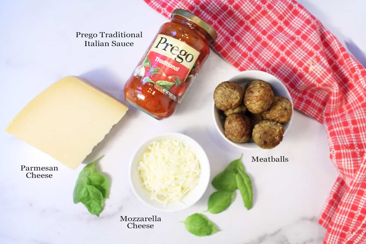 Meatball Tacos ingredients on white table labeled.