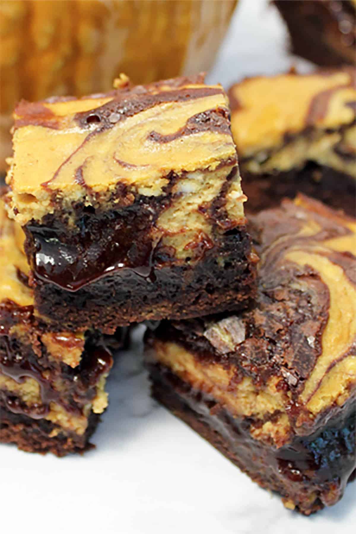Closeup of pumpkin cheesecake brownies stack.