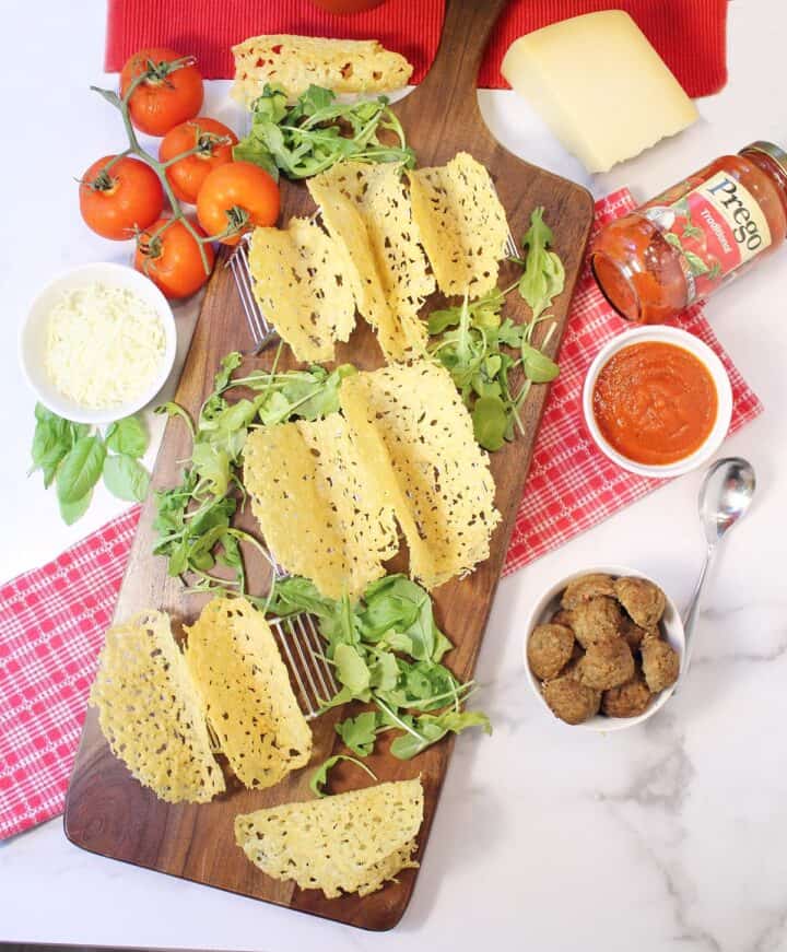 Ready to assemble tacos with tacos on wooden board.