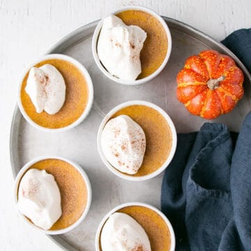 Tray of pumpkin egg custard in ramekins.