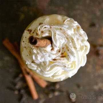 Overhead of Pumpkin Eggnog Smoothie topped with whipped cream.