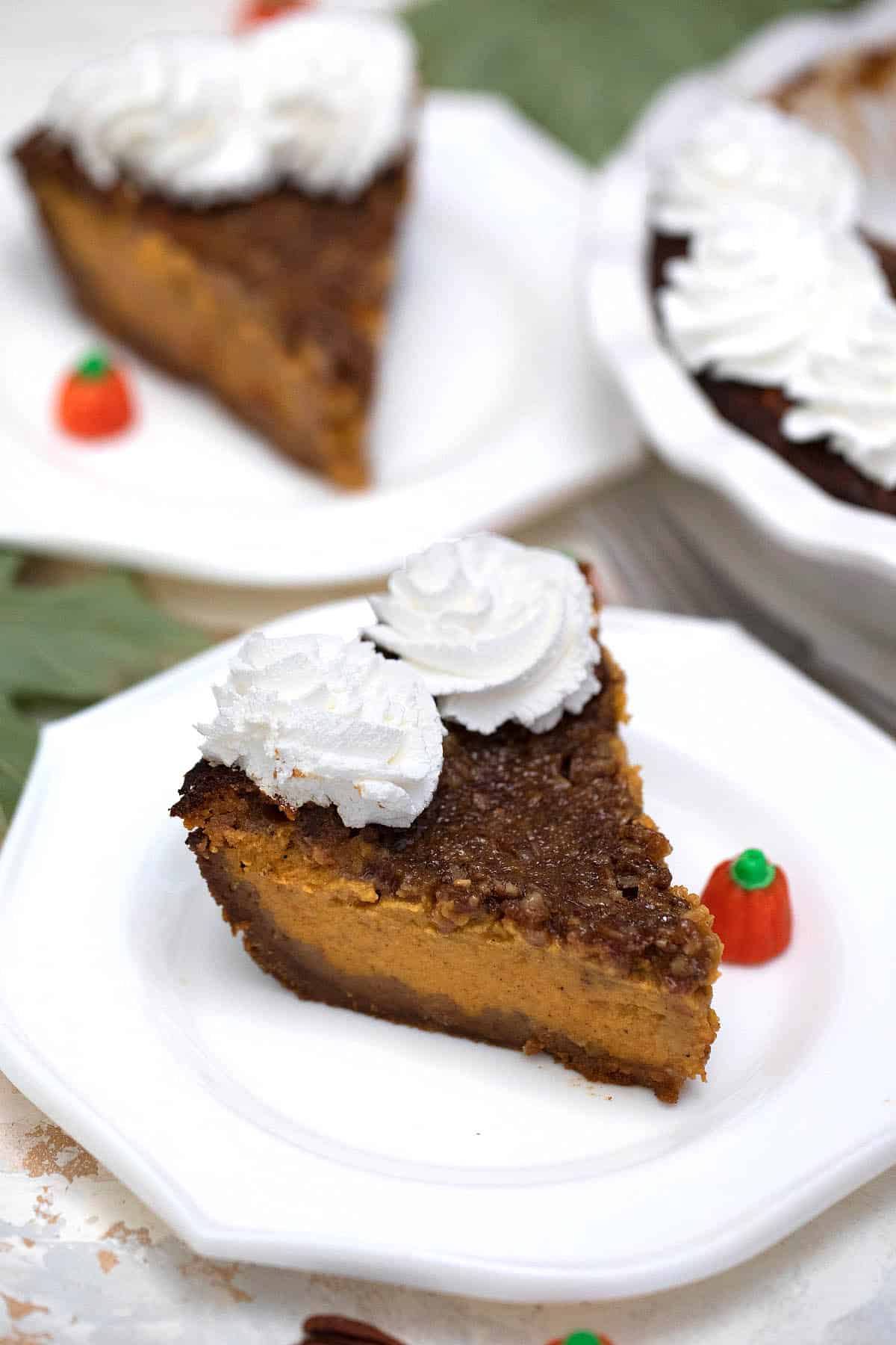 Two slices of pie on fall table.