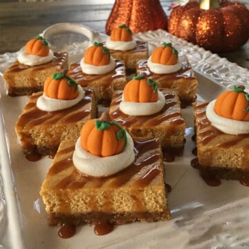 Salted Caramel Pumpkin Cheesecake Bars on tray.