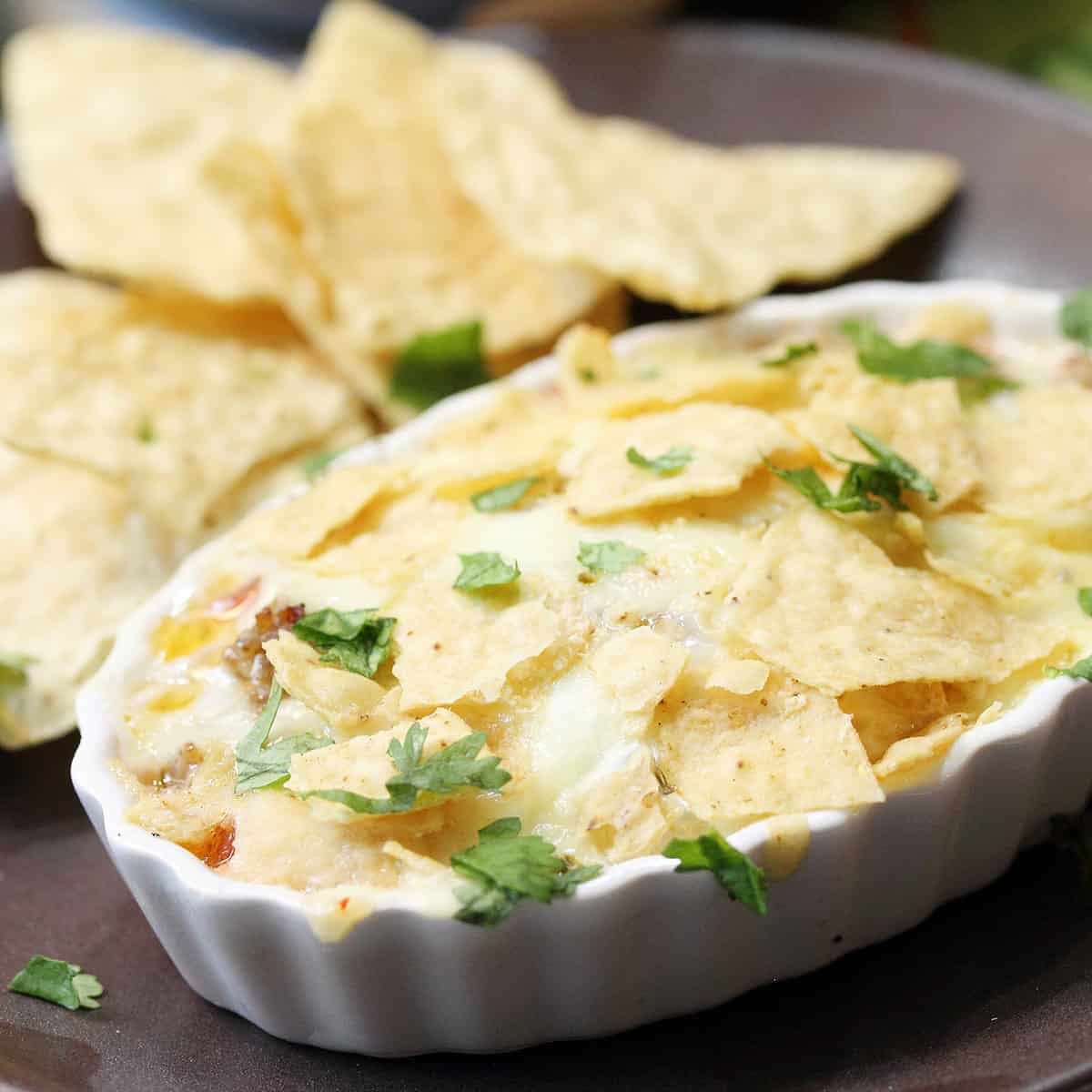 Closeup of single serving of Baked Huevos Rancheros in ramekin.
