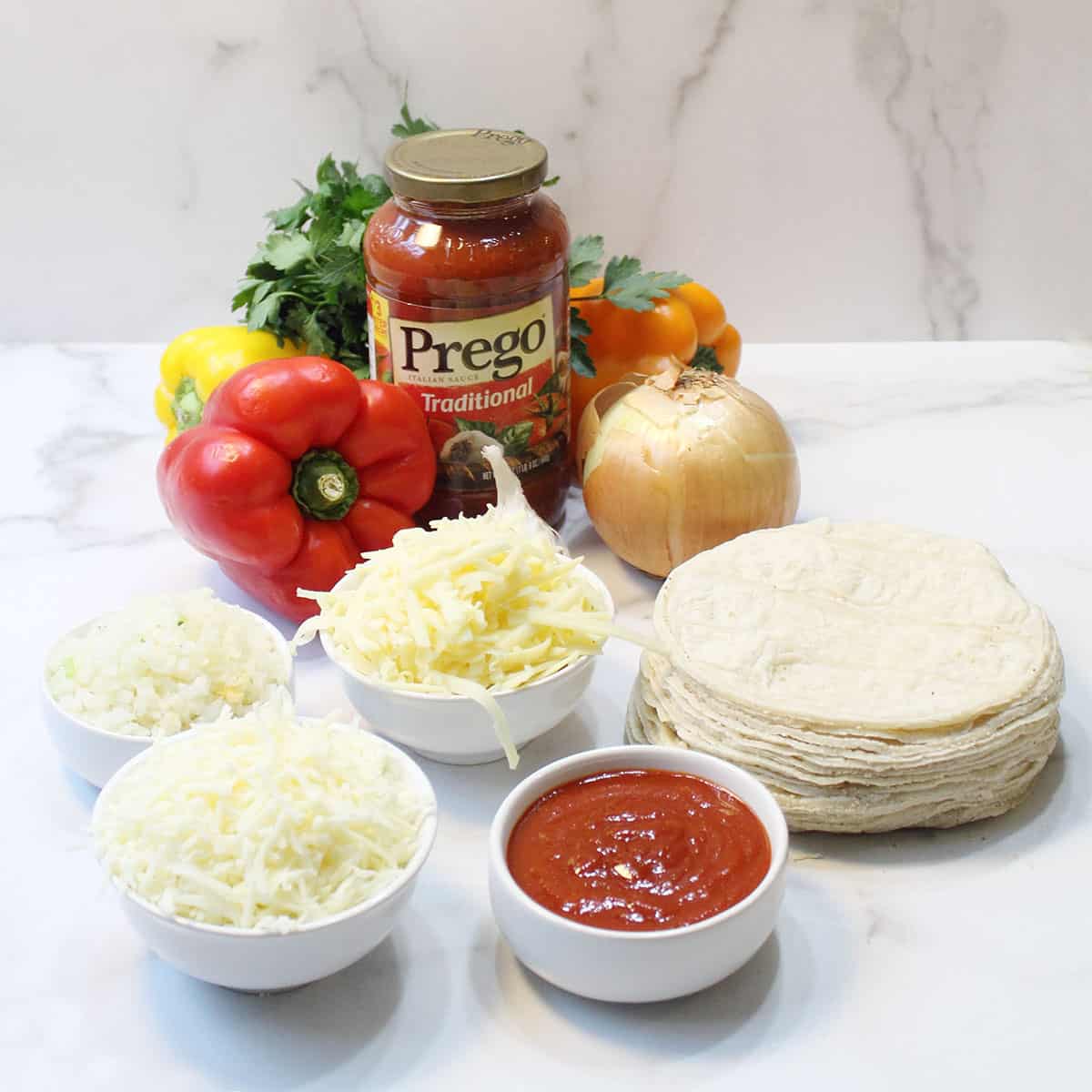 Ingredients for Turkey Frito Pie on white table.