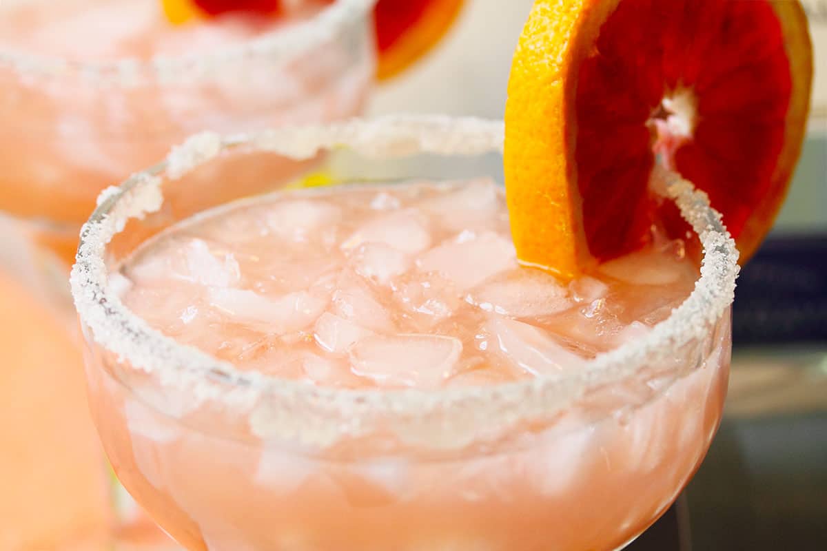 Looking over the top rim of garnished cocktail.
