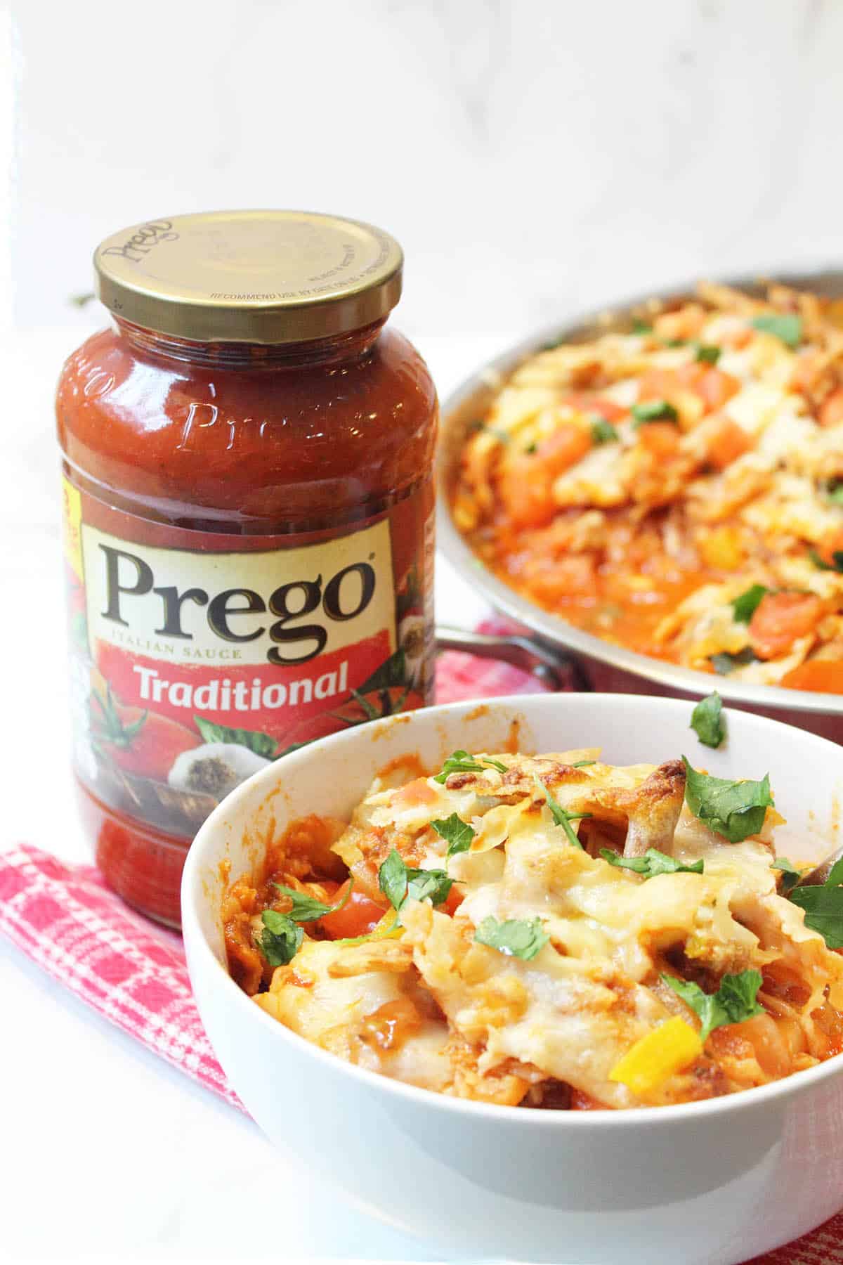 Prego Traditional Sauce with serving bowl of turkey chili and full skillet in background.