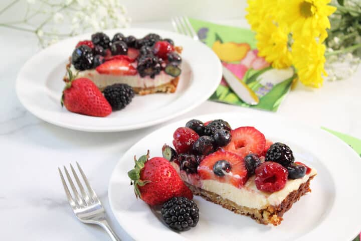 Two servings on white plates with fruit.