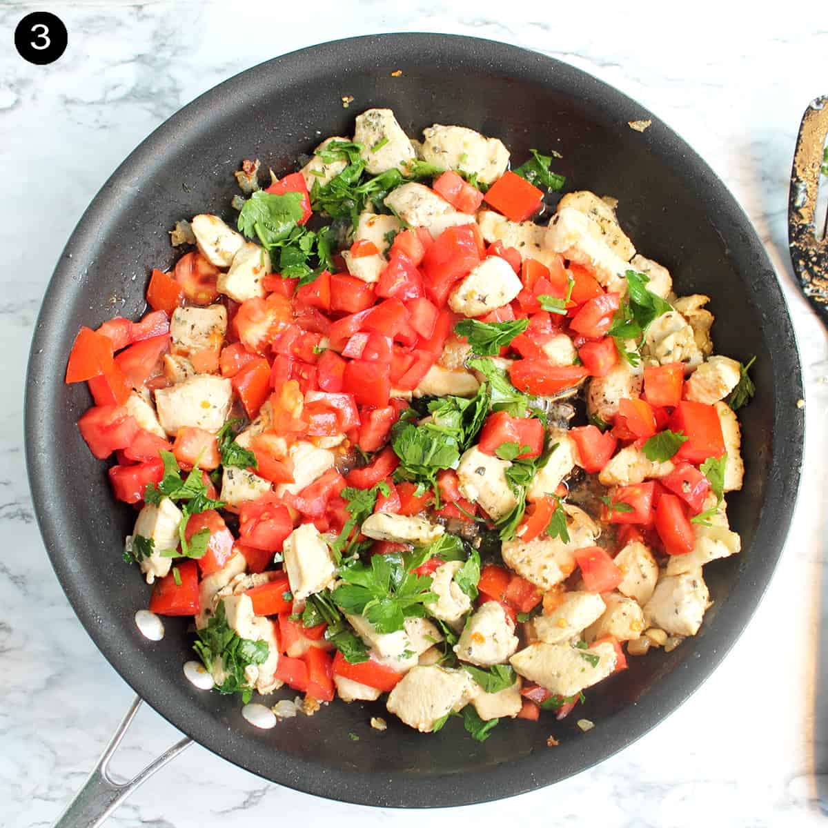 Adding tomatoes to skillet.