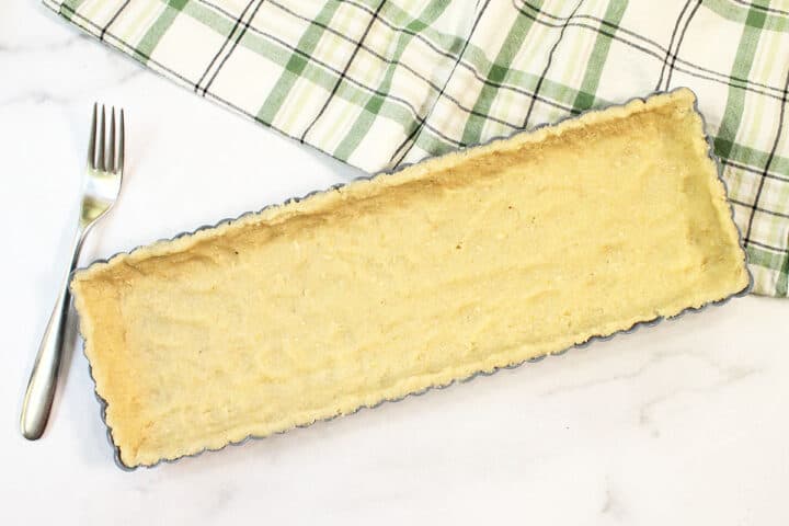 Press crust dough into tart pan.