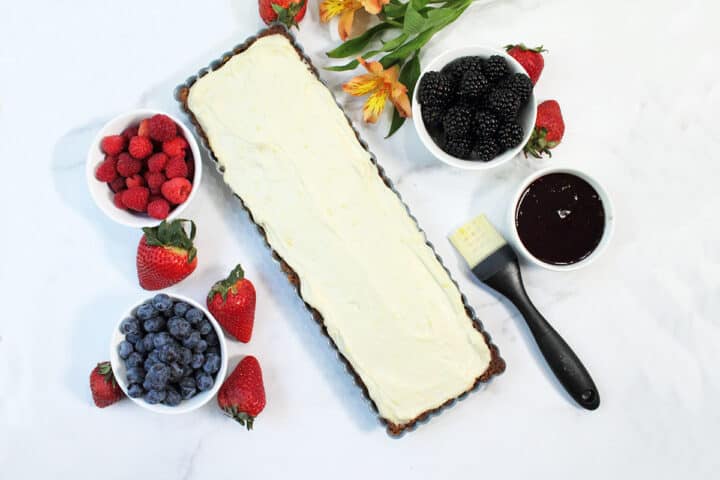 Lemon filling piled into tart shell.