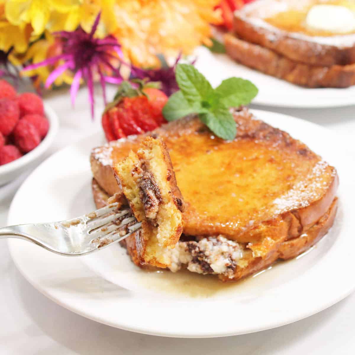 Bite of stuffed French Toast on fork.