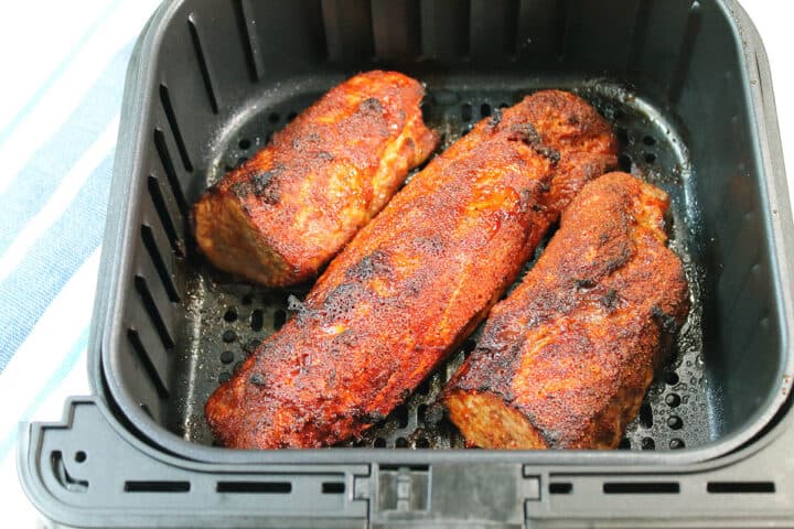 Closeup of cooked tenderloin in air fryer.