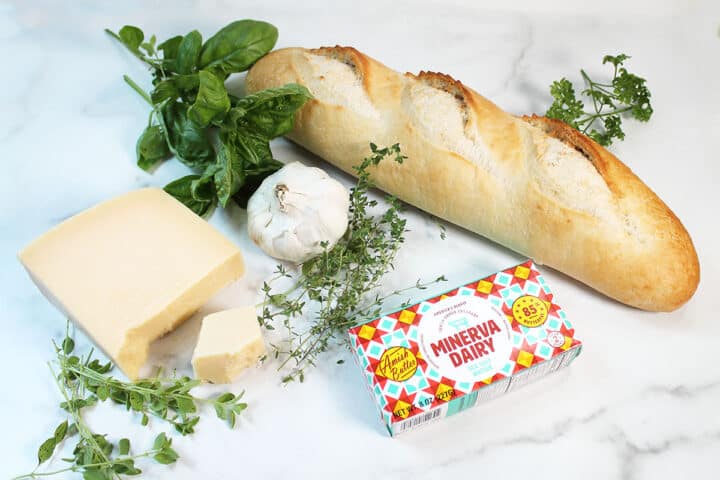 Air Fryer Garlic Bread ingredients on white table.