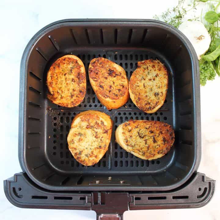 Finished air fried garlic bread in air fryer.