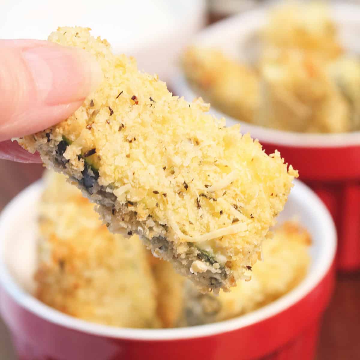 Closeup holding fry to show crisp coating.