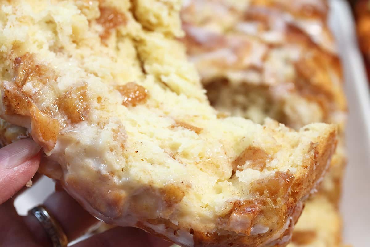 Closeup of slice of bread pulled from loaf.