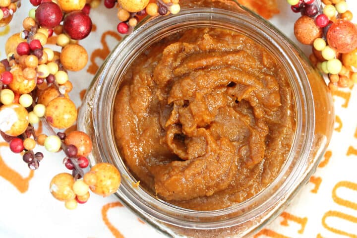 Overhead of pumpkin butter in jar.