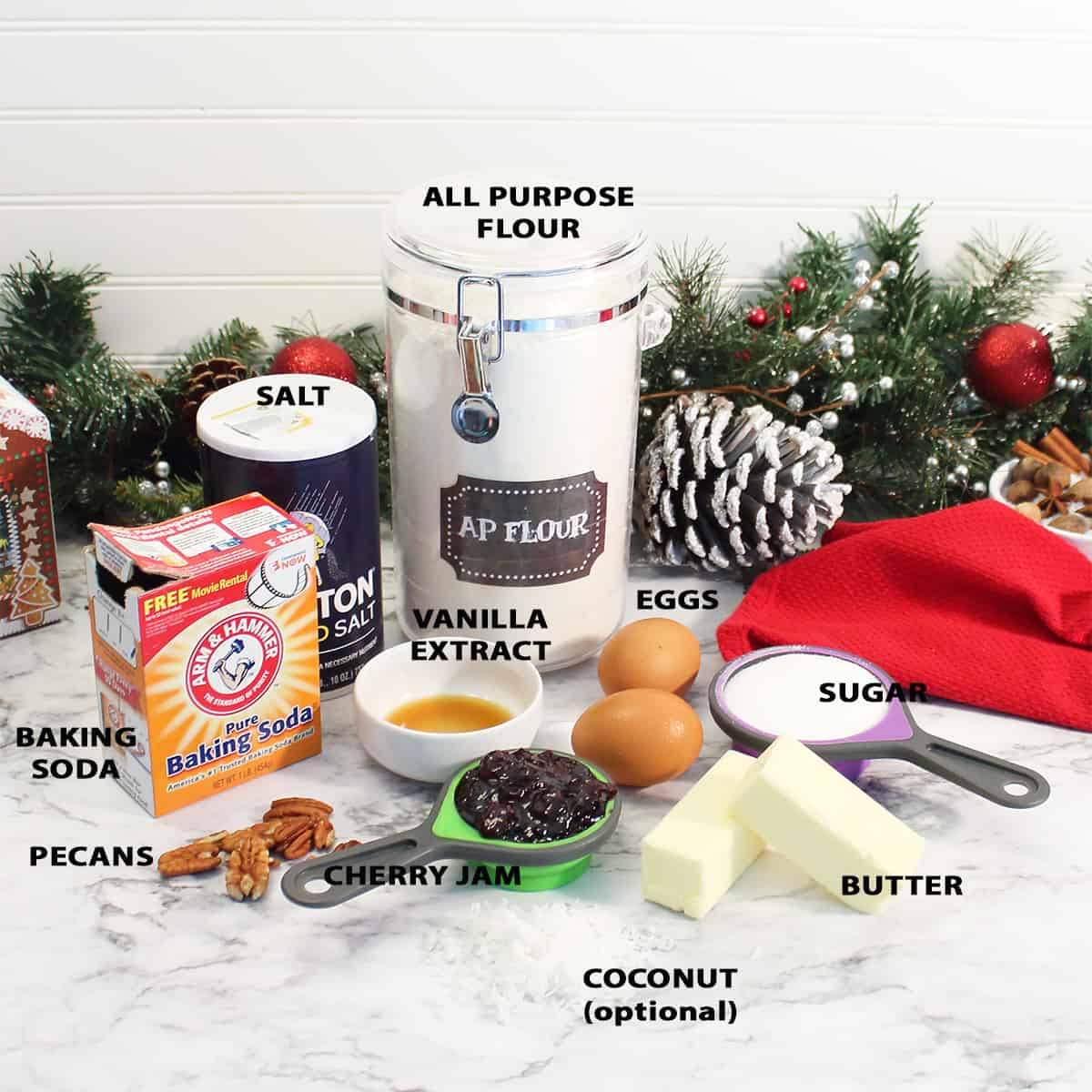 Ingredients for jam filled cookies on marble table.