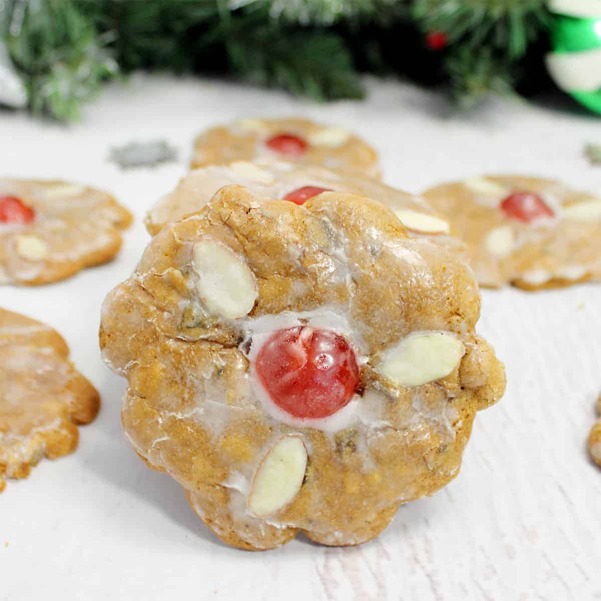 Closeup of lebkuchen cookie among scattered cookies.