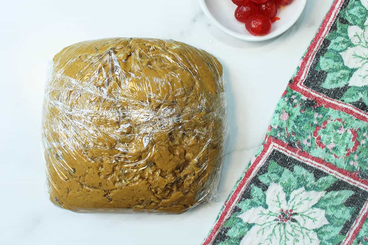 Dough wrapped in plastic wrap and ready to be refrigerated.