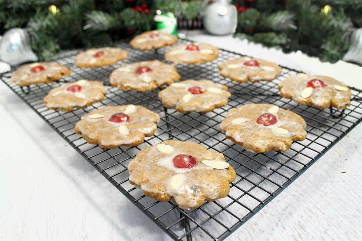 Iced german gingerbread cookies with nuts and cherries.