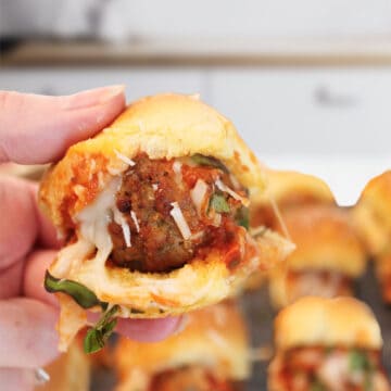 Holding slider over serving board.