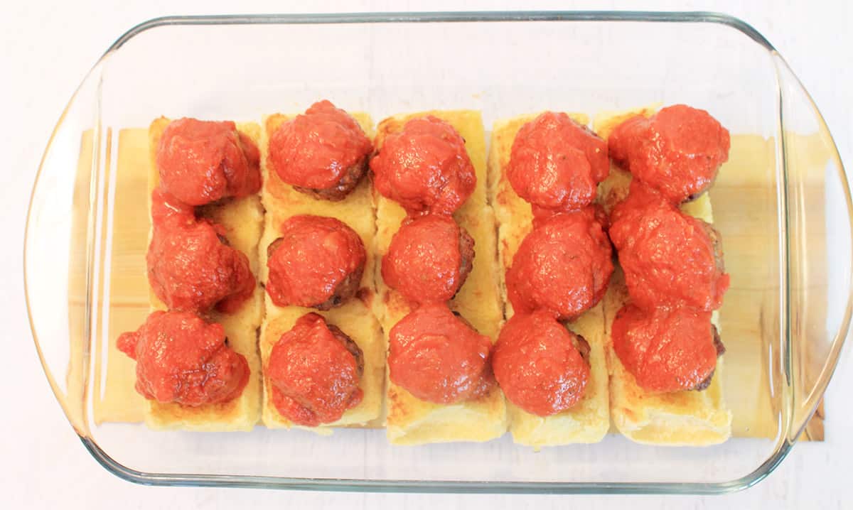 Meatballs covered with marinara.