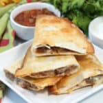 Air Fryer Quesadillas, air fried crispy and cut in half.