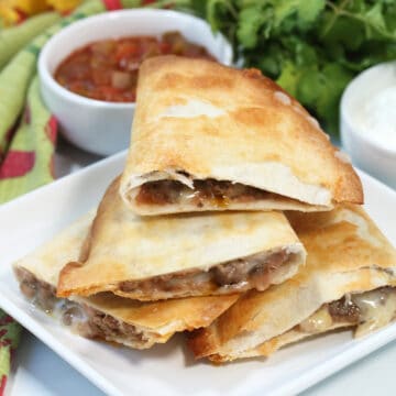 Air Fryer Quesadillas, air fried crispy and cut in half.