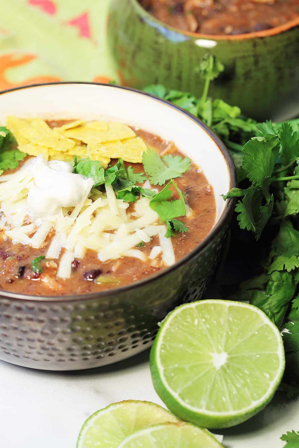 Closeup of garnished Mexican black bean soup with lime.