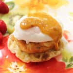 Hollandaise sauce covered crab cake eggs benedict.