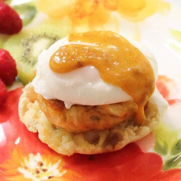 Hollandaise sauce covered crab cake eggs benedict.