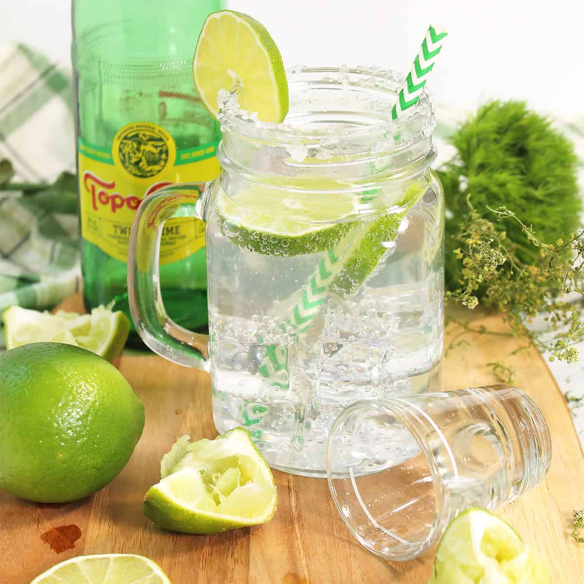 Texas Ranch Water Drink on board with lime wedges.