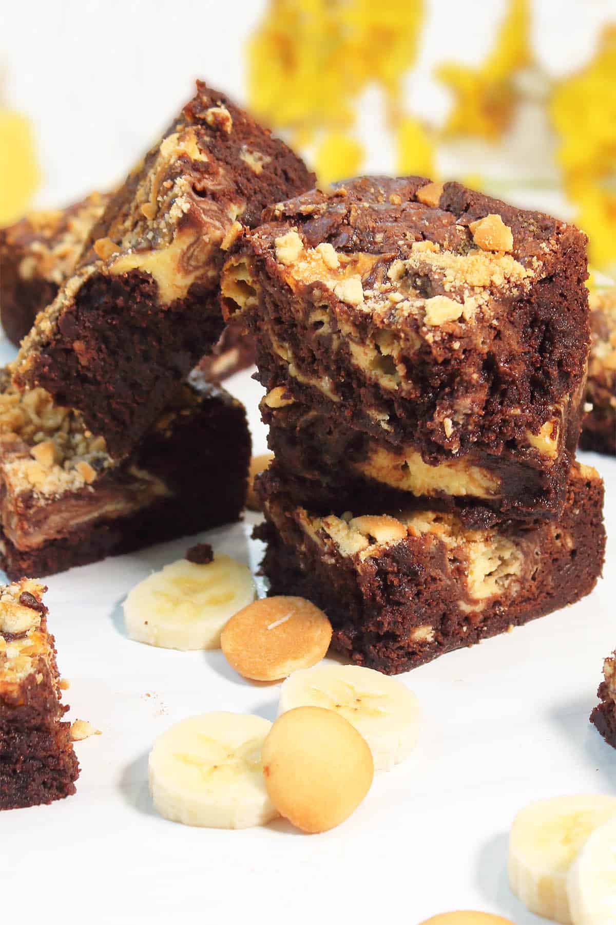 Stack of Banana Pudding Brownies on white table.