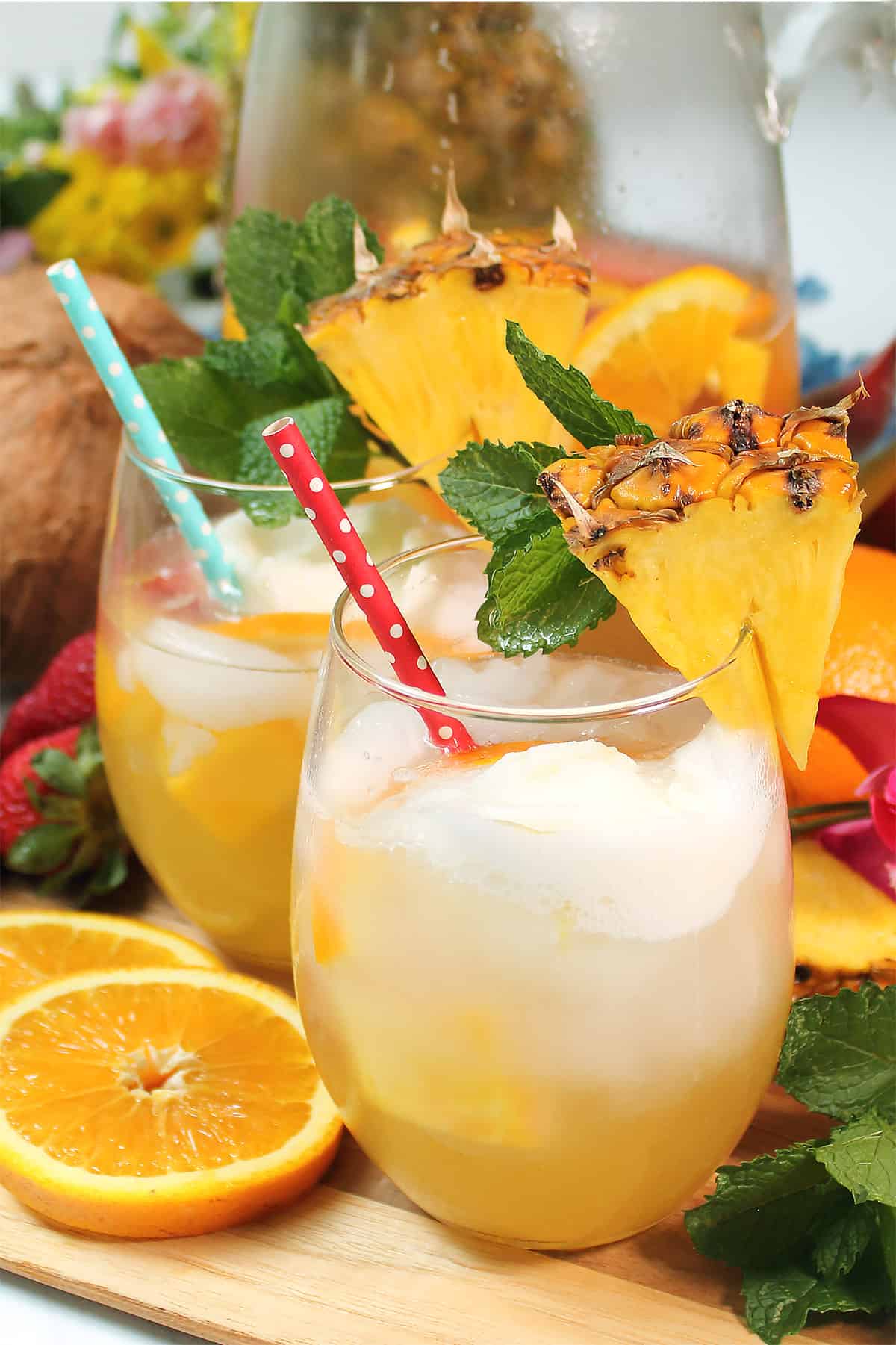 Pineapple Sangria in glasses with straws.