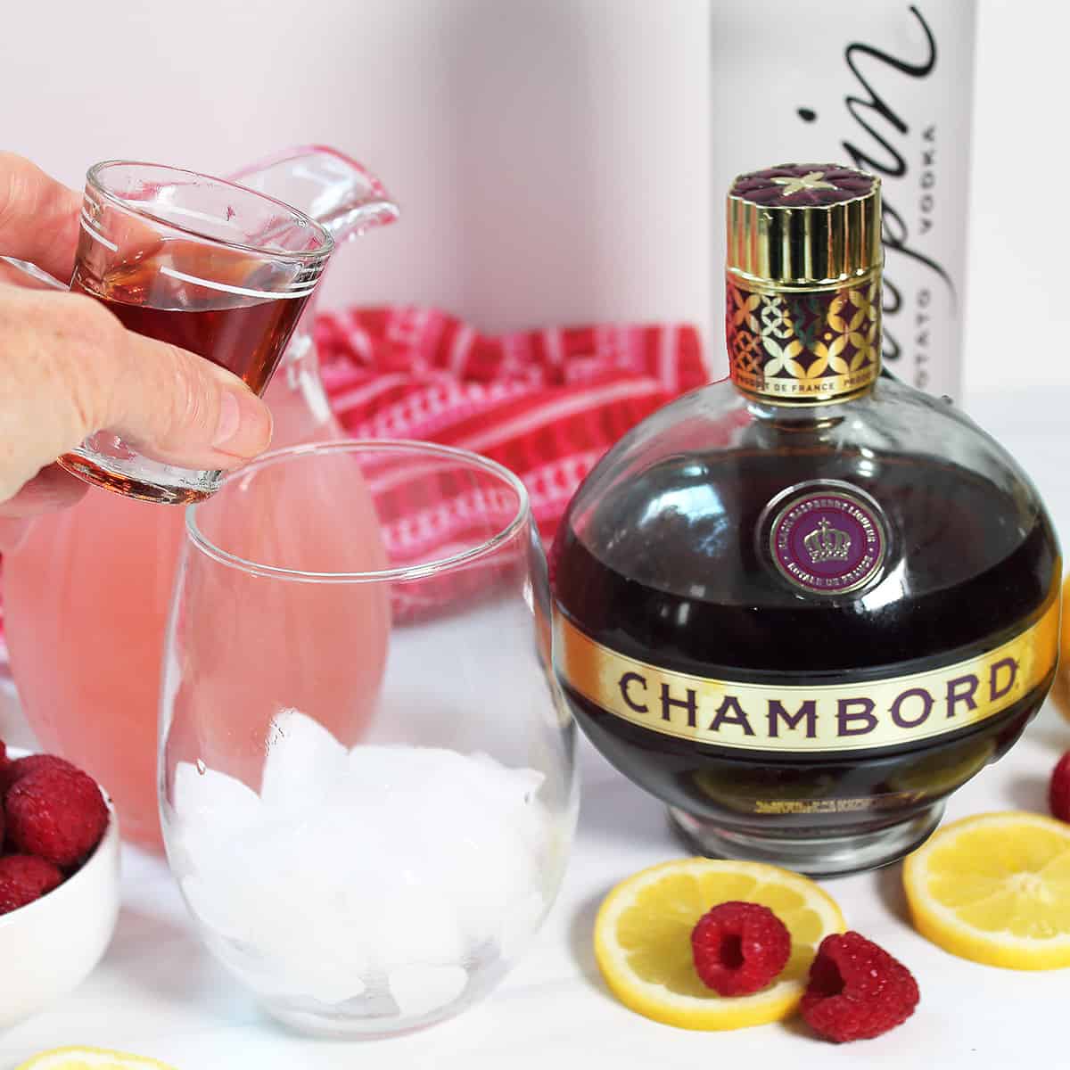 Chambord in shot glass ready to add to cocktail.