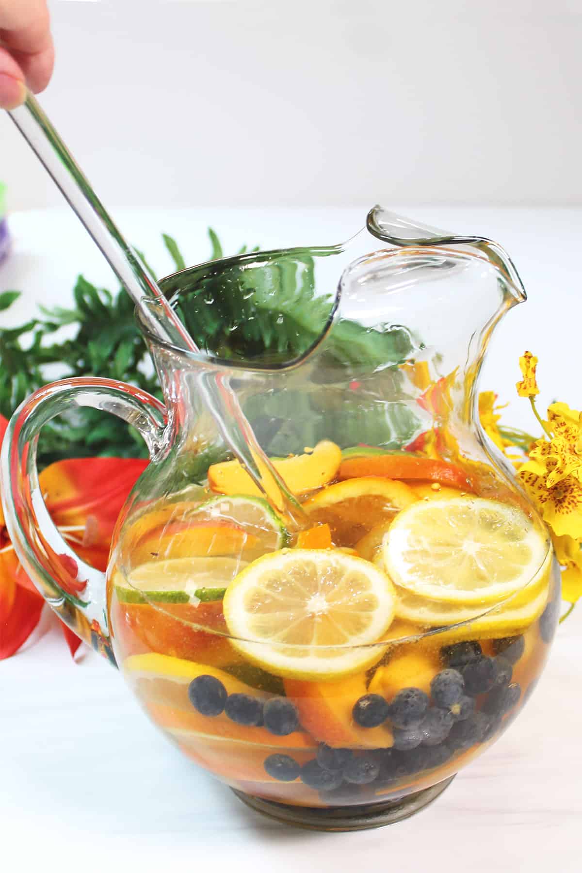 Stirring ingredients in pitcher.