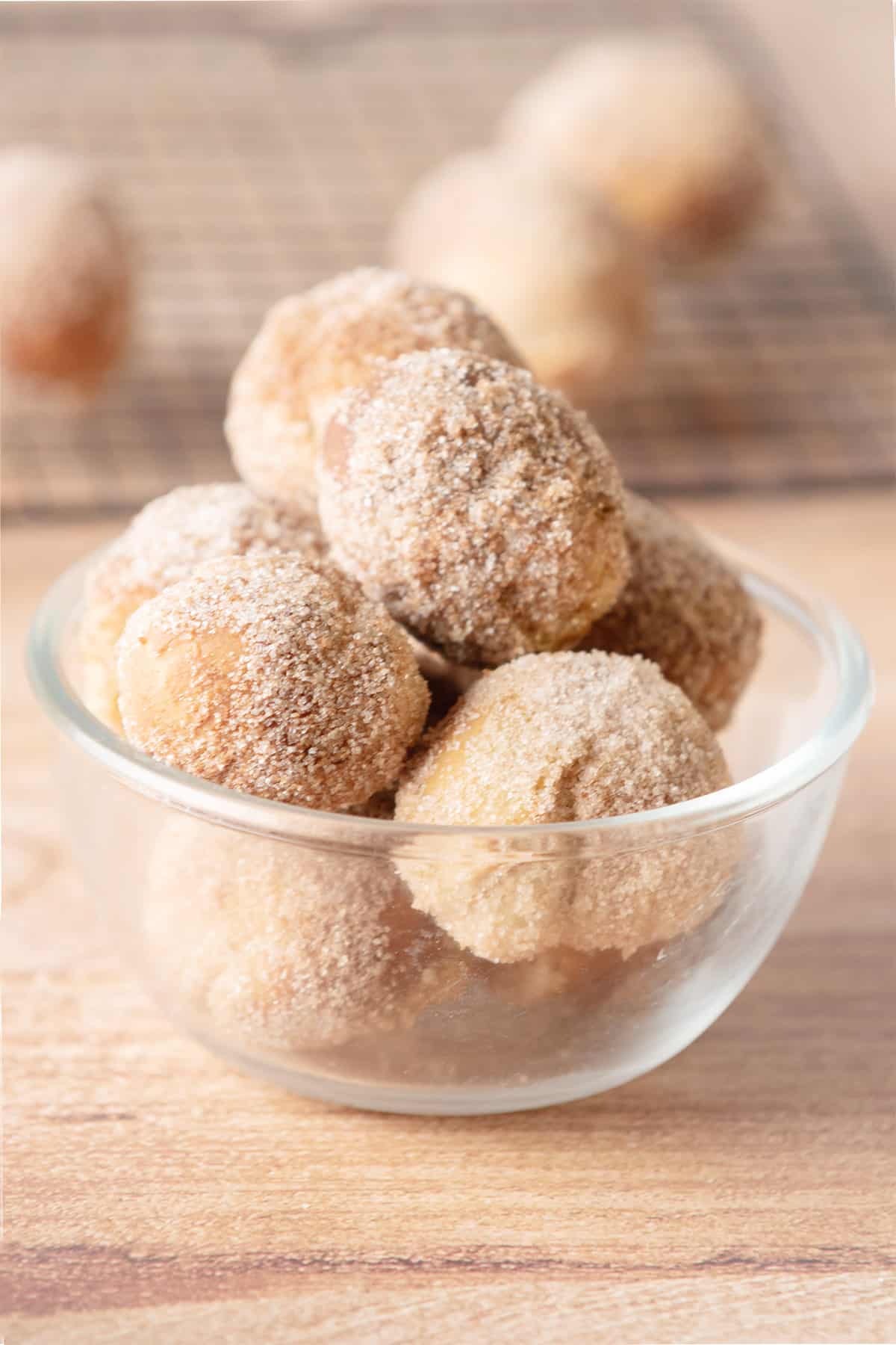 Air Fryer Cinnamon Sugar Donut Holes in glass bowl.