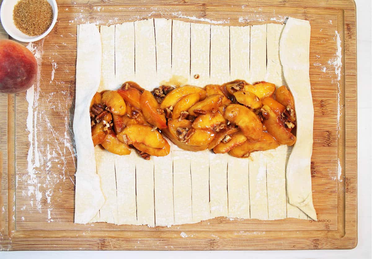 Folding ends of pastry over filling.