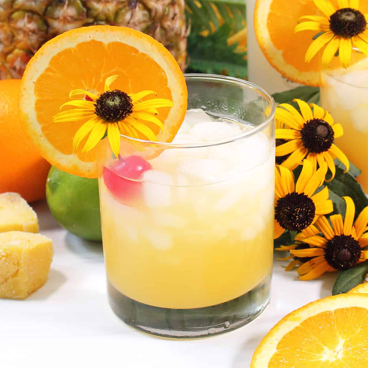 One garnished cocktail with flowers.