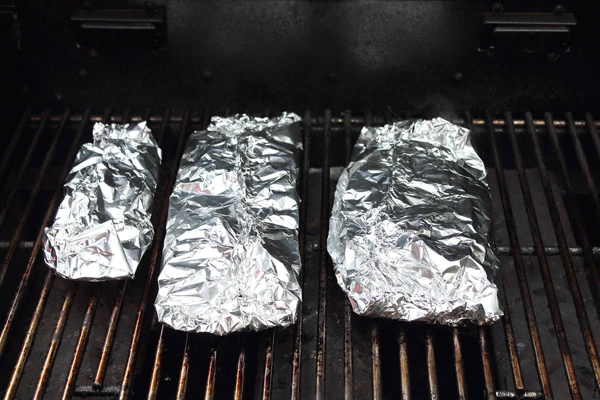 Grilling fish on gas grill.