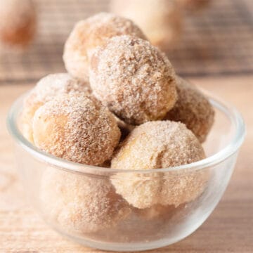 Glass bowl of donut holes.