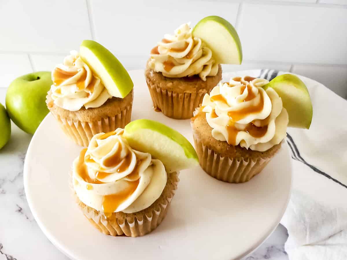 Overhead of apple cupcakes on cake stand.