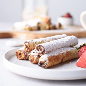 Closeup of rollups on white plate.