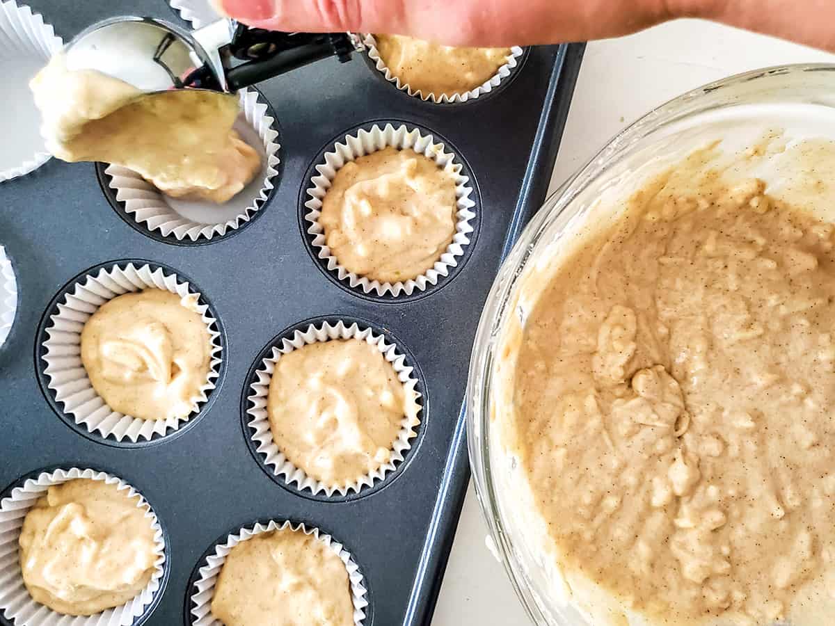 Scooping batter into cupcake pan.